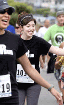 Ashley and Mel, two more Sterling team members, are all smiles as they lead the Sterling team to race end